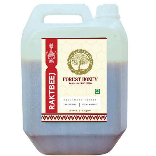 Large container of Raktbee Forest Honey with a visible label on a white background