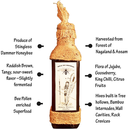 Handcrafted glass bottle filled with dark stingless bee honey, sealed with a cork and labeled