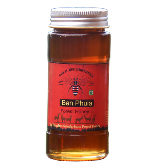 Raw honey in a glass bottle labeled Sundarbans Mangrove Forest Honey