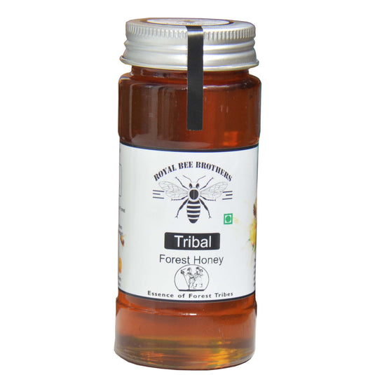 Jar of Tribal Forest Honey with a white label on a white background