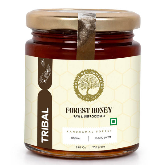 Pure unprocessed tribal forest honey from India with rich amber color and natural medicinal floral notes