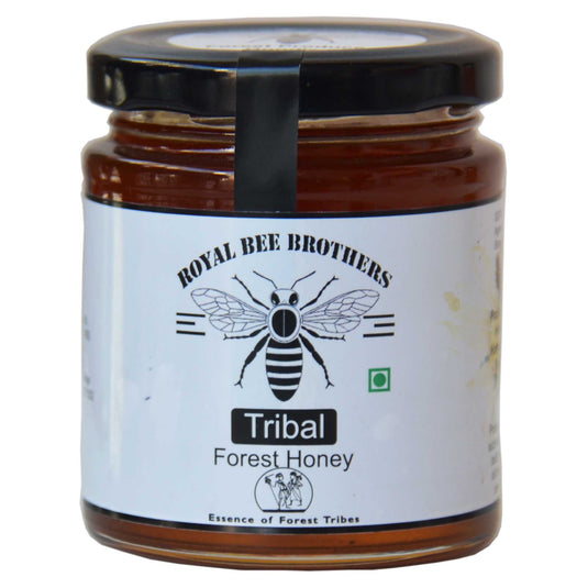 Glass bottle of tribal forest honey with natural amber color