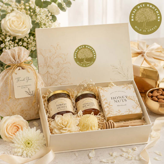 Luxury wedding gift hamper featuring artisanal forest honey, handcrafted keepsakes, and elegant packaging, perfect for memorable wedding return gifts in India.