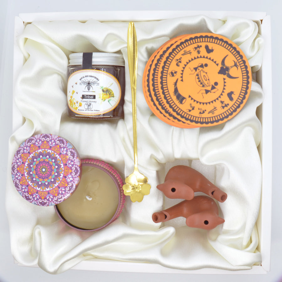 Adi- Contains forest honey, tribal tea coaster, beeswax candle, clay water bird whistle, spoon