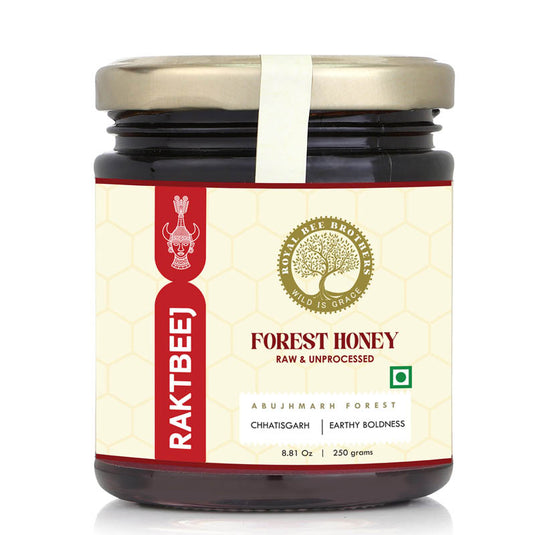 Raw black forest honey with deep amber color ethically harvested from untouched tribal forests of India